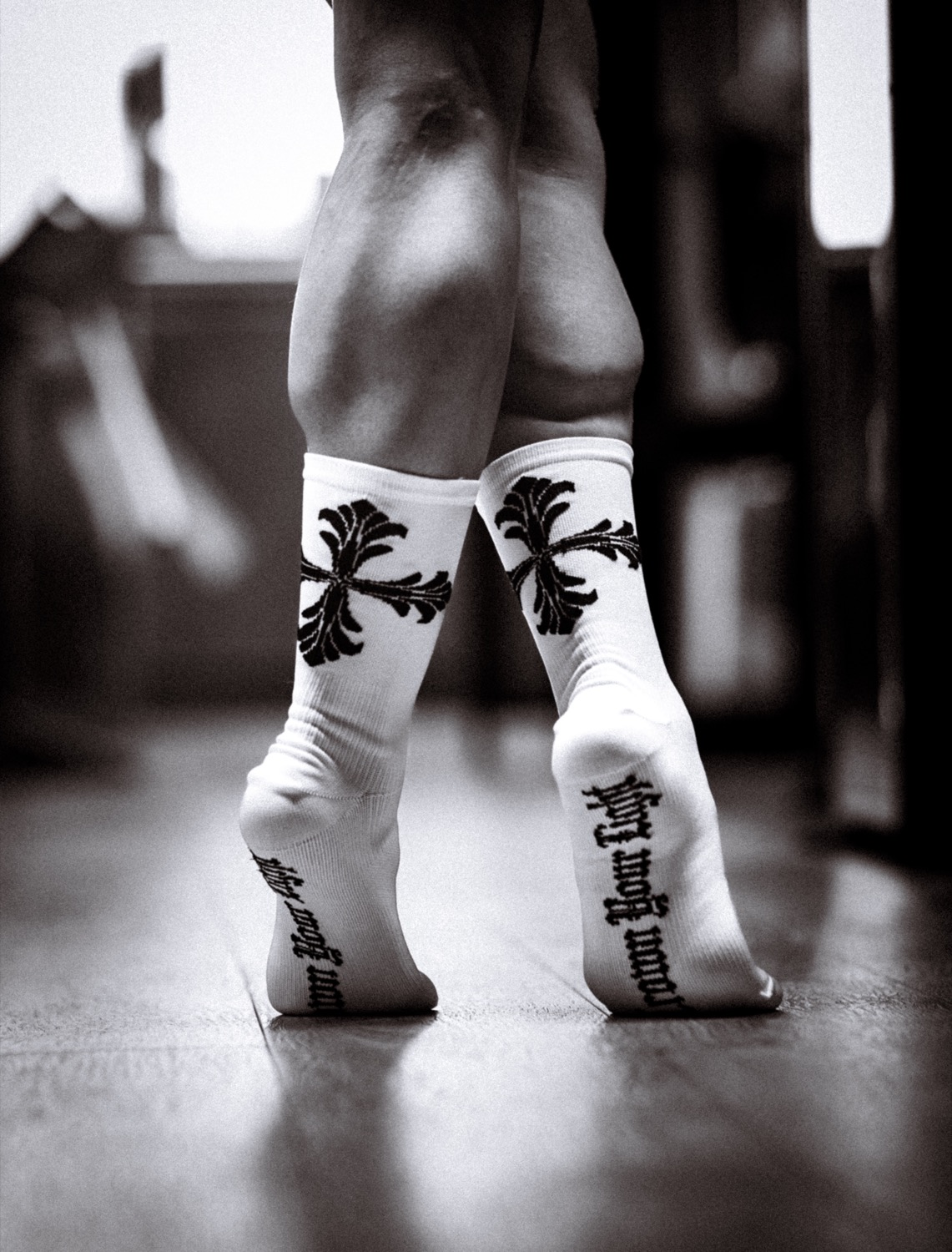 White socks with a black ornamental design, rear view